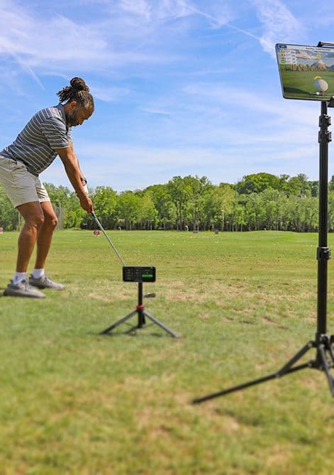 Golfer in motion at the range