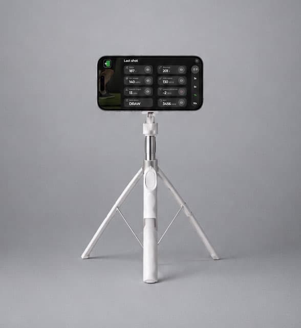 White tripod holding a phone